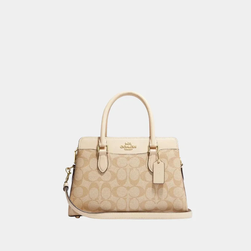 Coach Borough bags with a structured silhouette and a magnetic - snap closureCoach Mini Darcie Carryall In Signature Canvas