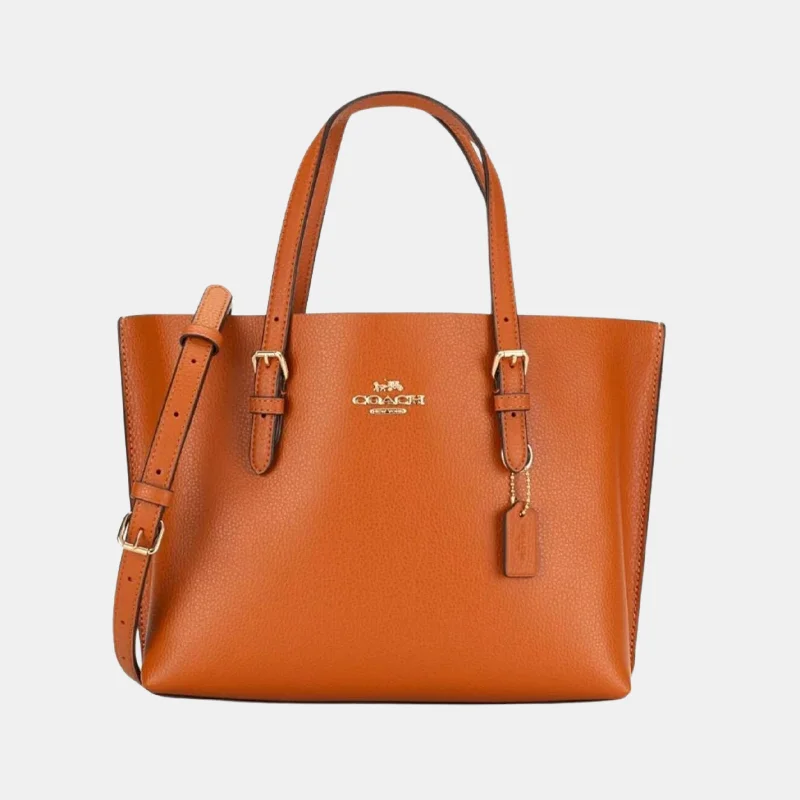 Coach bags with a zip - top closure and a front - pocket for quick accessCoach Mollie Tote