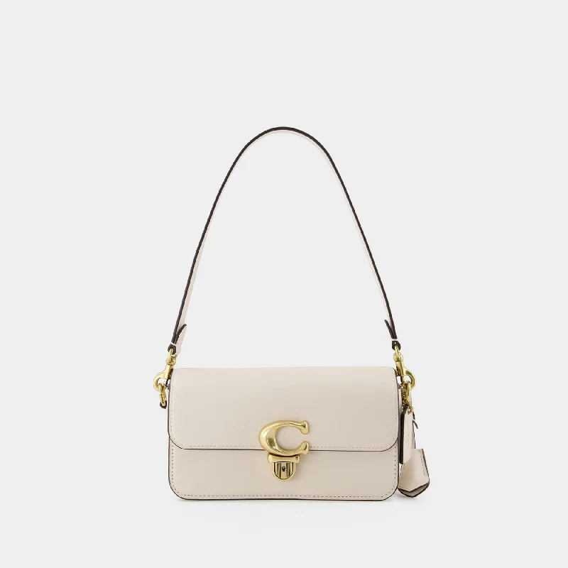 Coach bags with a zip - top closure and a front - pocket for quick accessHobo Studio Baguette - Coach - Leather - Beige