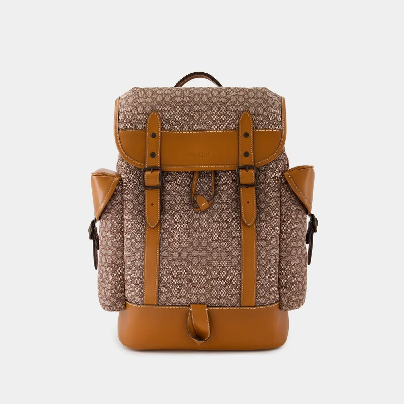 Coach handbags with a perforated leather detail for a breathable and unique designHitch Backpack - Coach - Leather - Cocoa