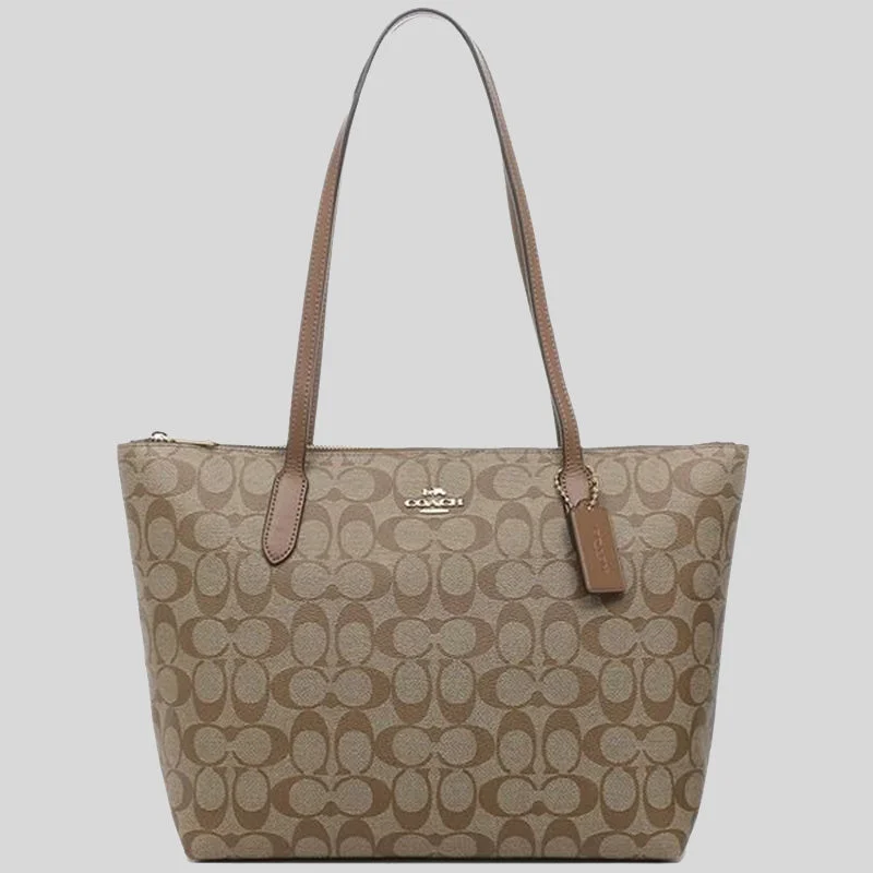 Coach handbags with a perforated leather detail for a breathable and unique designCOACH Zip Top Tote In Signature Canvas Khaki Saddle 4455