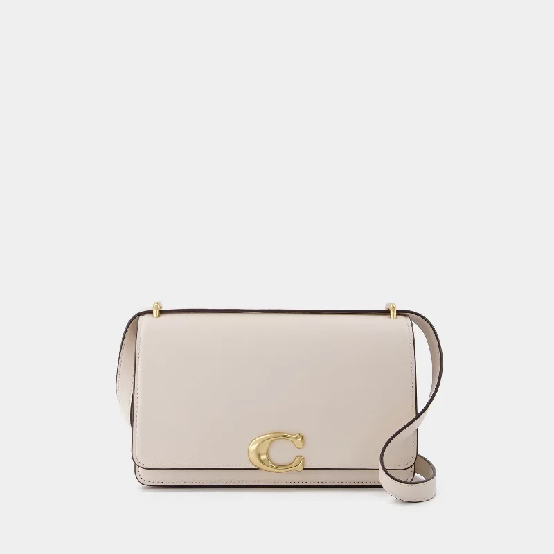 Coach bags with a chain - link trim and a leather body for a modern edgeBandit Shoulder Bag - Coach - Ivory - Leather