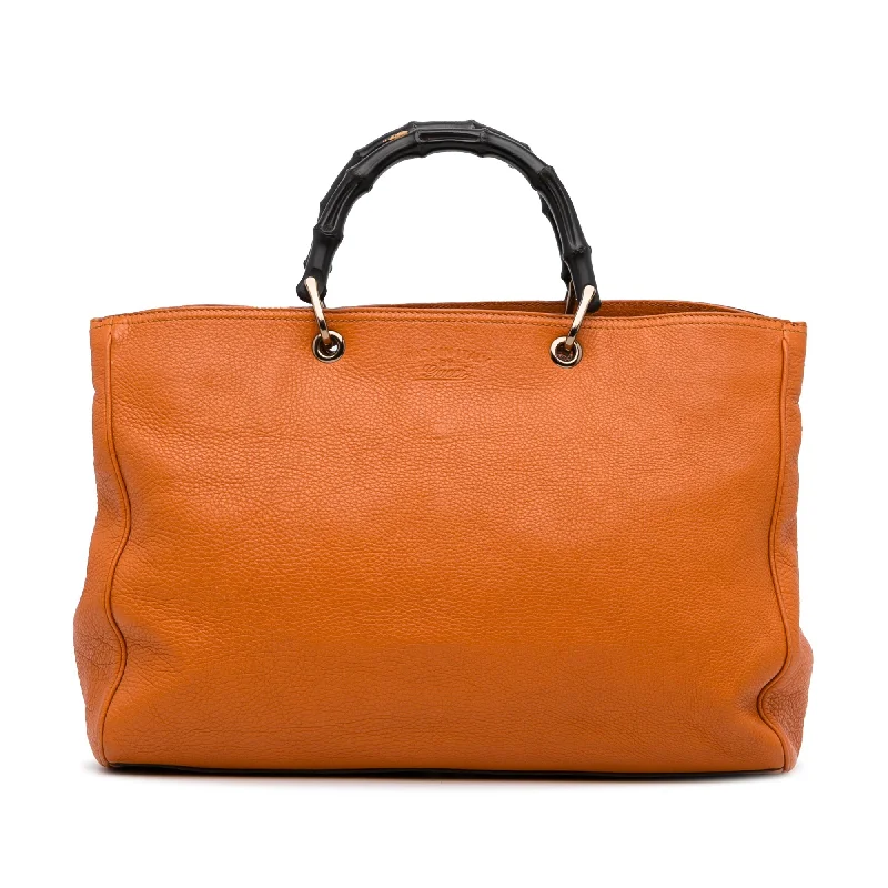 Women Gucci Sylvie bags with a leather - wrapped handleGucci Bamboo Shopper Large Orange