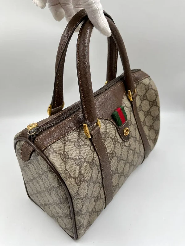 Women Gucci bags with a chain - link trim and a leather bodyVintage Gucci Boston Bag