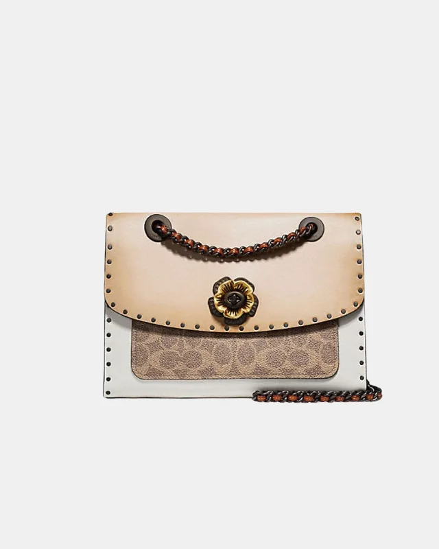 Coach handbags with a metal - framed clasp for durability and styleCoach Parker With Rivets And Snakeskin Details