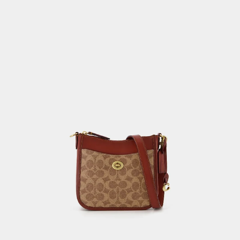 Coach Dempsey bags with a crystal - embellished C - logo for added luxuryChaise 19 Crossbody - Coach - Tan Rust - Canva