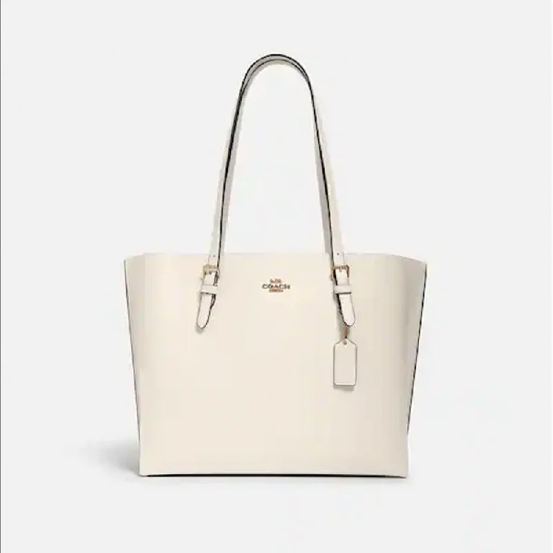 Coach tote bags with a snap - button closure and a decorative charm for styleCoach Mollie Tote Light Saddle