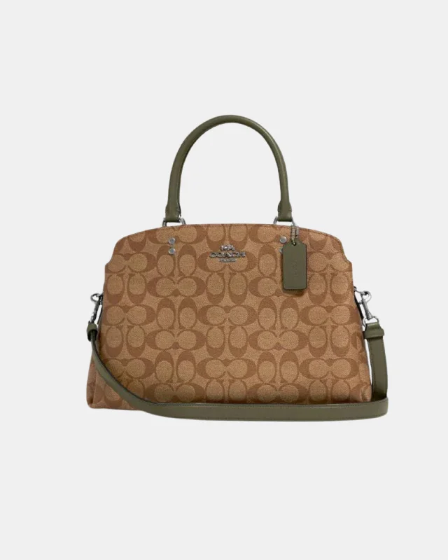 Ladies Coach Tabby bags with a textured leather surface for a more tactile lookCoach Lillie Carryall In Signature Canvas