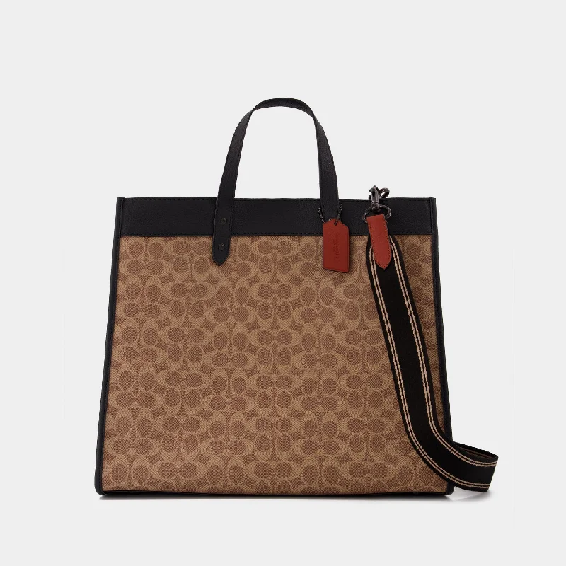 Coach Borough bags with a structured silhouette and a magnetic - snap closureField 40 Tote Bag - Coach - Tan - Canva