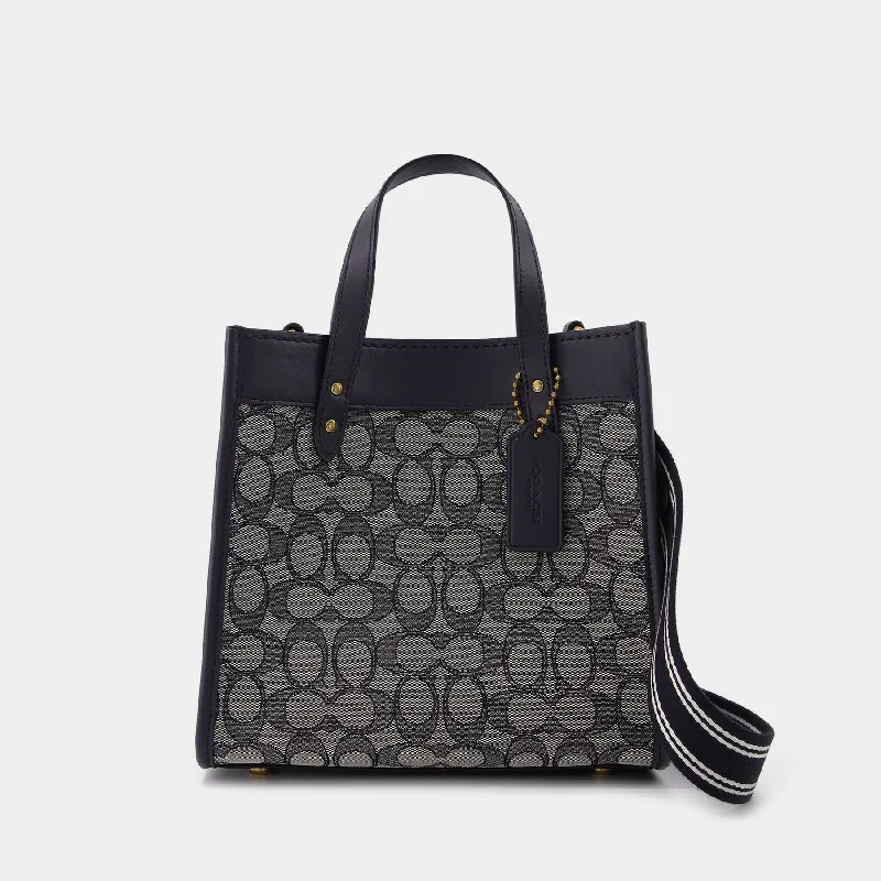 Coach tote bags with a water - resistant lining for practicalityField Tote 22 Tote Bag - Coach - Navy - Jacquard