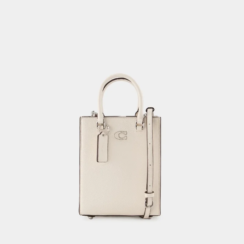 Coach tote bags with a spacious interior and multiple compartments for organizationTote 16 Tote Bag - Coach - Leather - White