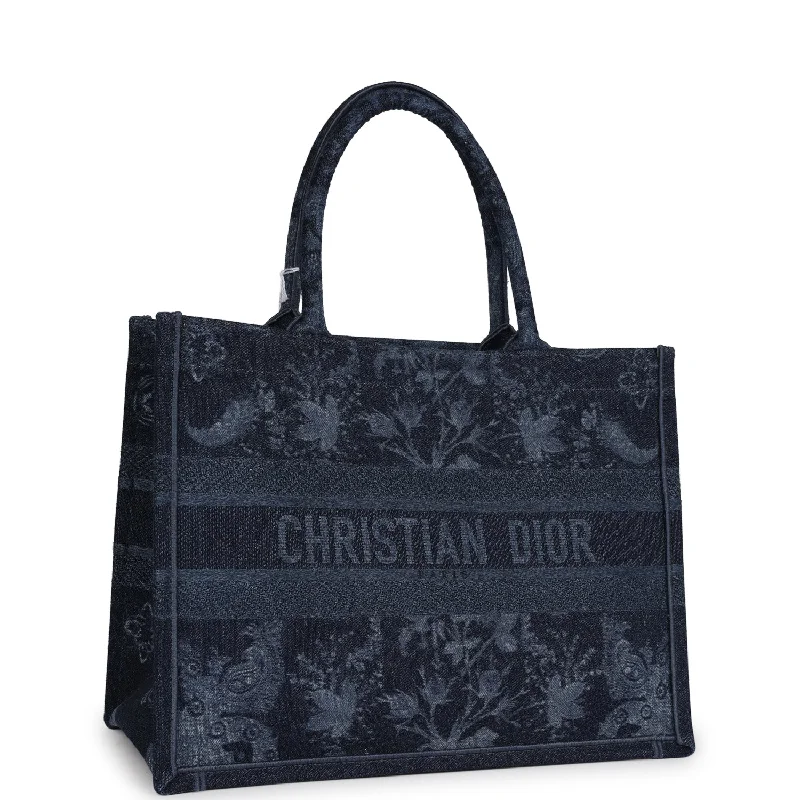 Christian Dior tote bags with a printed Dior logo on the frontChristian Dior Blue Flower Embroidered Denim Small Book Tote