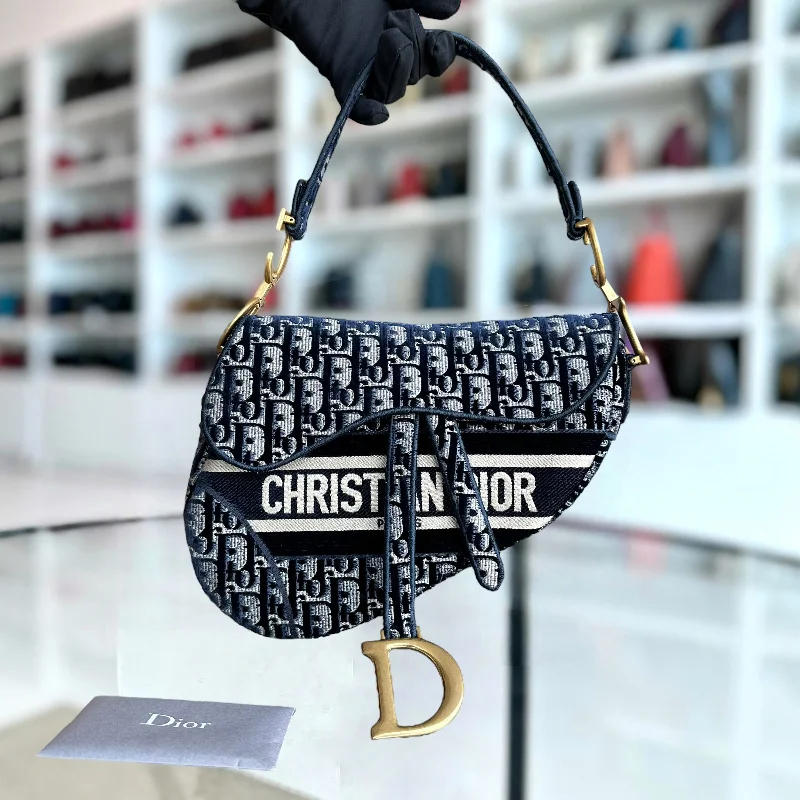 Christian Dior bags with a side - pocket for holding a water bottleMedium Saddle Oblique Canvas Dark Blue Golden Hardware